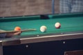 Sports game of billiards on a green cloth. Billiard balls with numbers on a pool table. Royalty Free Stock Photo