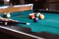 Sports game of billiards on a green cloth. Billiard balls with numbers on a pool table. Royalty Free Stock Photo