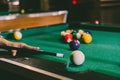 Sports game of billiards on a green cloth. Billiard balls with numbers on a pool table. Royalty Free Stock Photo