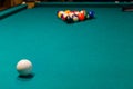 Sports game of billiards on a green cloth. Multi-colored billiard balls with numbers Royalty Free Stock Photo