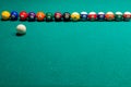 Sports game of billiards on a green cloth. Multi-colored billiard balls with numbers Royalty Free Stock Photo