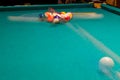 Sports game of billiards on a green cloth. Multi-colored billiard balls Royalty Free Stock Photo