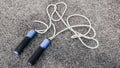 Sports gear accessories jump rope gray carpet