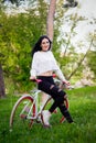 Sports girl rides a bicycle. emotions and lifestyle. Young beautiful woman riding a bike in the park. Active people. On the street Royalty Free Stock Photo