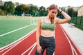 Sports girl on a stadium runway.