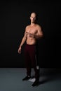 Athletic, beautiful strength in training pumps up muscles. Strong bodybuilder, perfect abs, shoulders, biceps, teres and Royalty Free Stock Photo