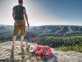 Sports guy have breakfast on rocky summit. Sport and motivation