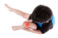 Sports injure. Asian child cyclist injured at knee. Isolated on