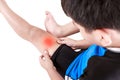 Sports injure. Asian child cyclist injured at thigh. Isolated on