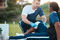 Sports, injury and man with bandage for accident, emergency and first aid for muscle sprain on field. Fitness Royalty Free Stock Photo