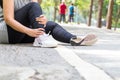 Sports injury. Woman with pain in ankle while jogging Royalty Free Stock Photo