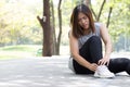 Sports injury. Woman with pain in ankle while jogging Royalty Free Stock Photo