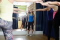 Sports instructor watches performance of exercises on an extension