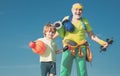 Sports for kids. Father and son sporting - family time together. Senior man and cute little boy exercising on blue sky Royalty Free Stock Photo