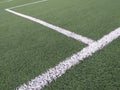 Sports lines painted on a green grass pitch. White lines painted on artificial grass on a soccer field View of artificial grass on Royalty Free Stock Photo