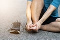 Sports man runner with injured foot while training on the asphalt road . Healthcare, medicine and people concept. Royalty Free Stock Photo