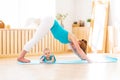 Sports mother is engaged in fitness and yoga with baby at home Royalty Free Stock Photo