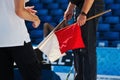 Sports official with flags in the hand Royalty Free Stock Photo