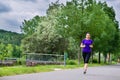 Sports outdoor - young woman running in park