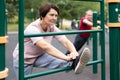 Sports pensioners are engaged in martial art on the sports ground in open air