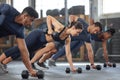 Sports people fitness training with weights at gym, workout exercise and being active at health center. Team of men and Royalty Free Stock Photo
