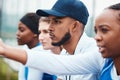 Sports, people and group of man and women watching a match together at a field, focus and concentration. Diversity, team Royalty Free Stock Photo