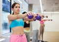 Sports people standing, perform various exercises, holding special small pilates balls in their hands Royalty Free Stock Photo