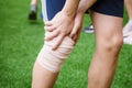 Sports person injured leg in the sport field