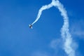 Sports plane performs aerobatic figures in the sky at the air Show. Royalty Free Stock Photo