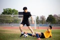 Sports and recreation concept two male soccer players attending regular practice sessions and memorizing attack and defense