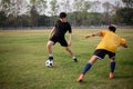 Sports and recreation concept two male soccer players attending regular practice sessions and memorizing attack and defense