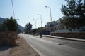 Cyclists ride along the Eparchiaki Odos Lardou-Lindou highway in August. Lardos, Rhodes Island, Greece Royalty Free Stock Photo