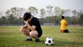 Sports and recreation a moment of victory and defeat of two players after the football match Royalty Free Stock Photo