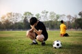 Sports and recreation a moment of victory and defeat of two players after the football match Royalty Free Stock Photo