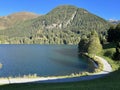 Sports and recreational trail along the alpine lake Davos or loop around mountain Lake Davosersee, Davos Dorf