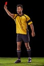 Sports, referee or man with a red card for warning, foul call or penalty review in football game on turf. Soccer match Royalty Free Stock Photo