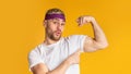 Sports results concept. Funny man shows biceps Royalty Free Stock Photo