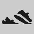 Running shoe symbol on gray backdrop Royalty Free Stock Photo