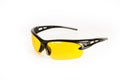 Sports and safety glasses made of black plastic with yellow glasses, shot on a white background Royalty Free Stock Photo