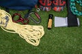 Sports set for extreme sports, on green lawn, ax, rope, carbines