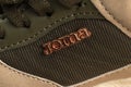 Sports shoes of the Joma brand. Logo close-up