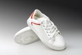 sports shoes, sports white sneakers on a gray background with a space for the label