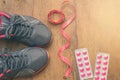 Sports sneaker shoe with measuring tape and blisters of medica