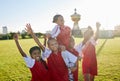 Sports. soccer and young girls with trophy celebrate, happy and excited outside on field for their victory. Team Royalty Free Stock Photo