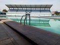 sports swimming pool with spectator stands in the background