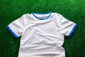 Sports t-shirt against artificial turf. Studio shot. Copy space. Royalty Free Stock Photo