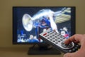 Sports television remote control in the hand, zapping Royalty Free Stock Photo