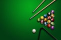 Sports theme with billiards, a full set of billiard balls, cue, on a green background. top view, flat lay, copy space, snooker. Royalty Free Stock Photo