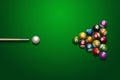 Sports theme with billiards, a full set of billiard balls, cue, on a green background. top view, flat lay, copy space, snooker. Royalty Free Stock Photo