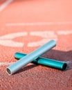 Sports, track and closeup of baton in a stadium for a relay race, marathon or competition. Fitness, running and zoom of Royalty Free Stock Photo